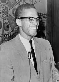 A smiling Malcolm X.