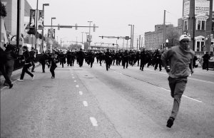 Baltimore protester on the run, 2015. Photo by: Devin Allen
